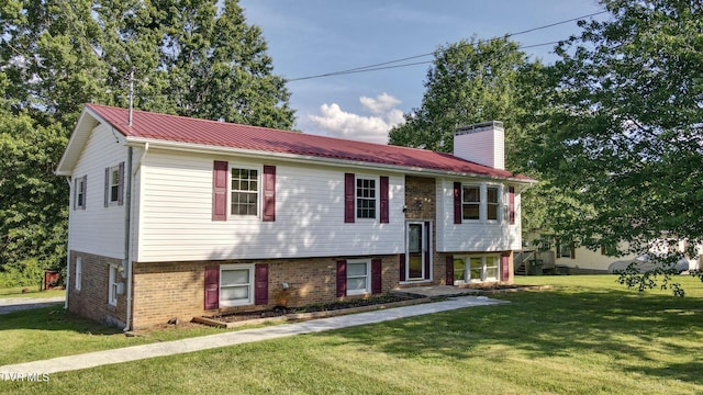 130 Kiser Cir, Jonesborough, TN 37659 - raised ranch with brick siding, a front lawn, a chimney, and a metal roof