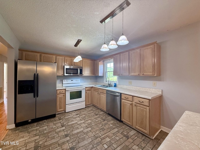 130 Kiser Cir, Jonesborough, TN 37659 - kitchen featuring appliances with stainless steel finishes, light countertops, a textured ceiling, pendant lighting, and brick patterned floors