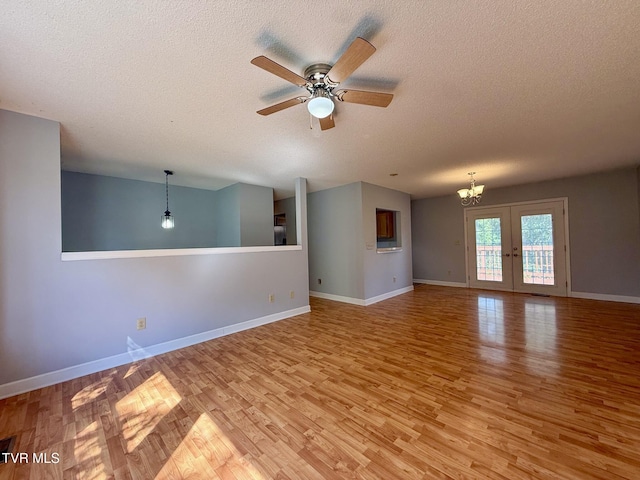 130 Kiser Cir, Jonesborough, TN 37659 - unfurnished room with light wood-style floors, a textured ceiling, ceiling fan, and a chandelier
