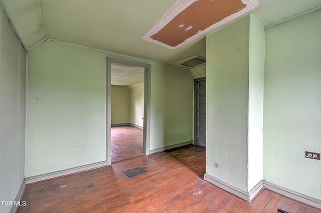 1230 Carolina Ave, Bristol, TN 37620 - unfurnished room with wood finished floors and lofted ceiling