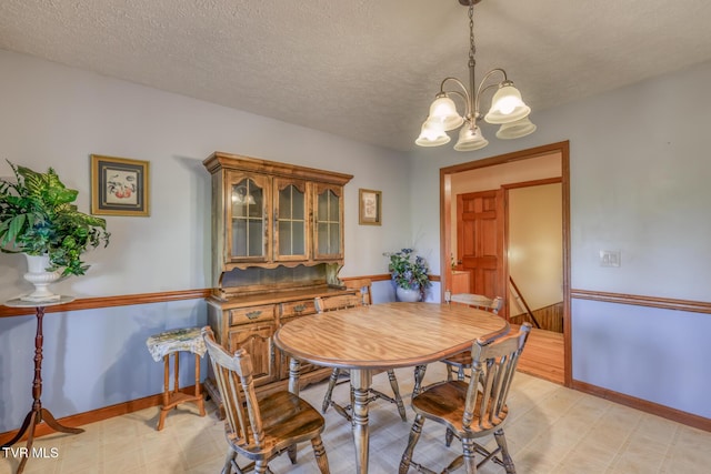 15060 Peaceful Valley Rd, Abingdon, VA 24210 - dining space with light flooring, a chandelier, and a textured ceiling