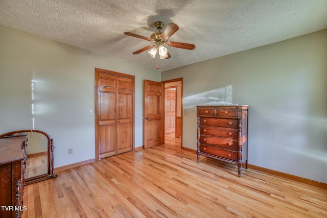 15060 Peaceful Valley Rd, Abingdon, VA 24210 - bedroom featuring wood finished floors, a textured ceiling, a closet, and a ceiling fan