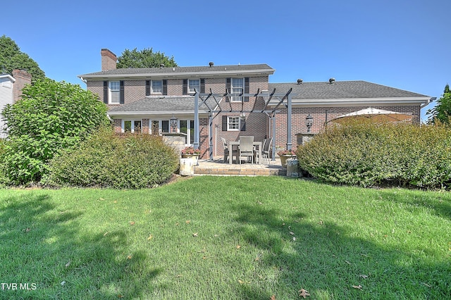 6054 Old Jonesboro Rd, Bristol, TN 37620 - rear view of property featuring a patio area, a chimney, a lawn, a pergola, and brick siding
