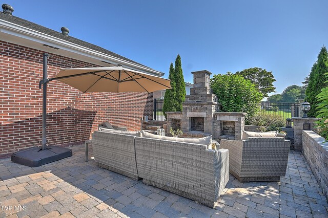 6054 Old Jonesboro Rd, Bristol, TN 37620 - view of patio / terrace featuring an outdoor living space with a fireplace