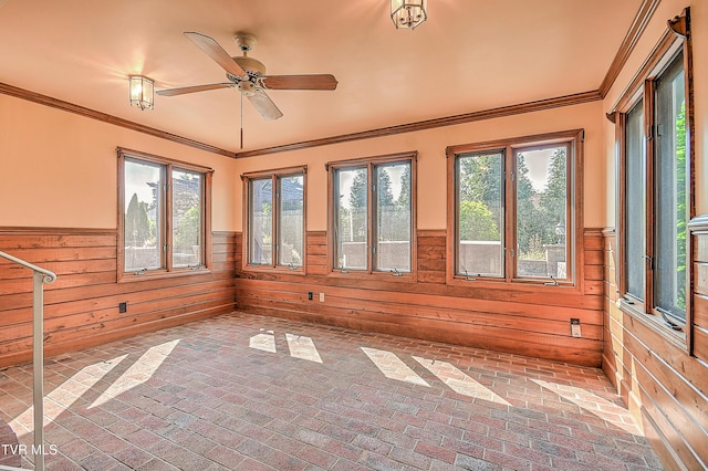 6054 Old Jonesboro Rd, Bristol, TN 37620 - unfurnished sunroom featuring healthy amount of natural light, wainscoting, wood walls, brick flooring, and crown molding