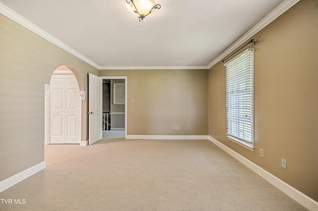 6054 Old Jonesboro Rd, Bristol, TN 37620 - spare room with crown molding, arched walkways, and light colored carpet