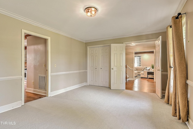 6054 Old Jonesboro Rd, Bristol, TN 37620 - unfurnished bedroom with carpet flooring, crown molding, and a closet