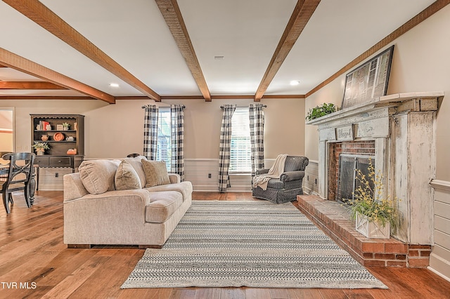 6054 Old Jonesboro Rd, Bristol, TN 37620 - living area with beam ceiling, wood-type flooring, a fireplace with raised hearth, crown molding, and recessed lighting