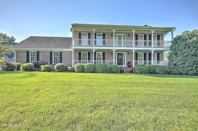 6054 Old Jonesboro Rd, Bristol, TN 37620 - view of front of house with covered porch, brick siding, and a front lawn