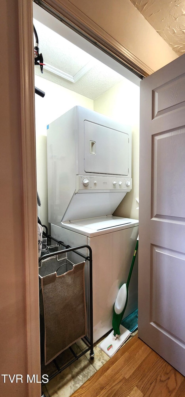 312 Old Franklin Pl Unit 5, Jonesborough, TN 37659 - laundry area with stacked washing machine and dryer and wood finished floors