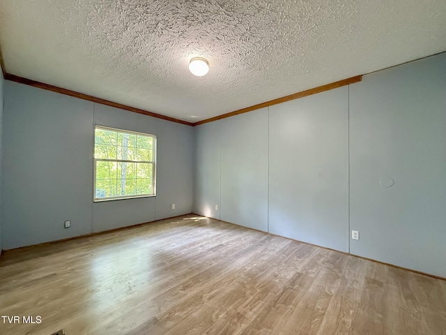 943 Newman Hollow Rd, Bean Station, TN 37708 - empty room with a textured ceiling, crown molding, and wood finished floors