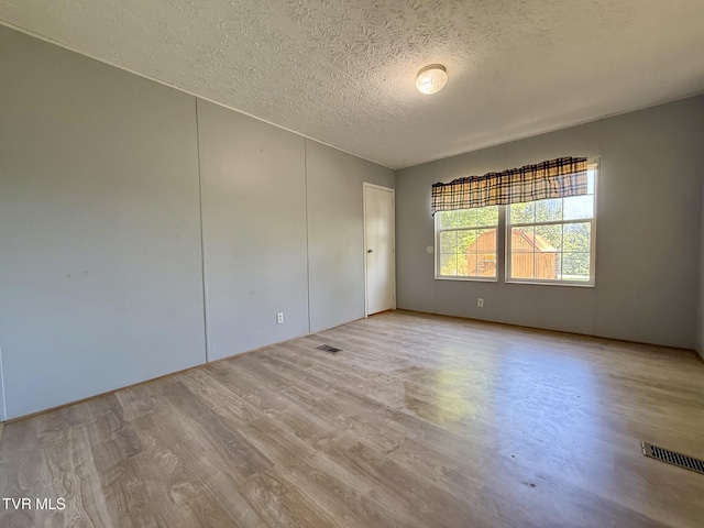 943 Newman Hollow Rd, Bean Station, TN 37708 - empty room featuring a textured ceiling and wood finished floors