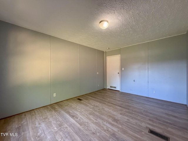 943 Newman Hollow Rd, Bean Station, TN 37708 - spare room featuring wood finished floors and a textured ceiling