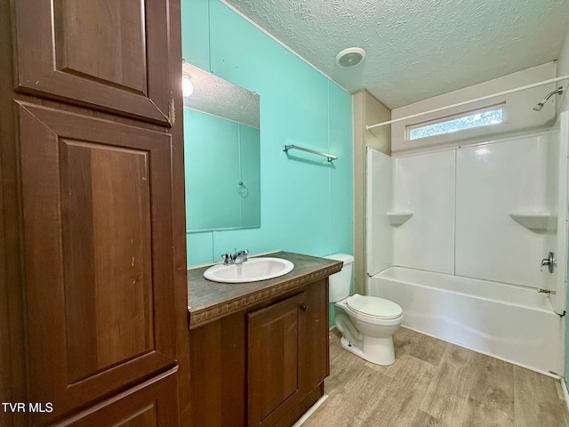 943 Newman Hollow Rd, Bean Station, TN 37708 - bathroom with a textured ceiling, wood finished floors, vanity, and  shower combination