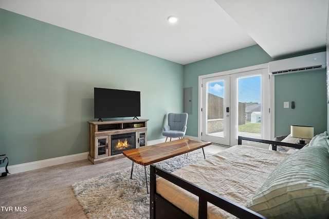 162 Bob Ford Rd, Jonesborough, TN 37659 - bedroom featuring a wall mounted AC, access to outside, french doors, and a glass covered fireplace