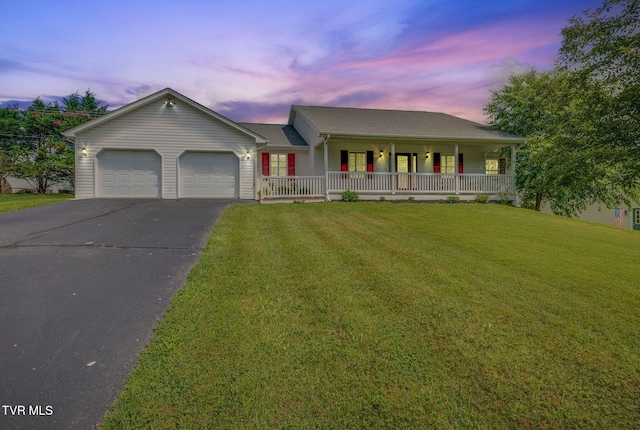 19275 Wyndale Rd, Abingdon, VA 24210 - ranch-style house with a porch, driveway, an attached garage, and a front lawn