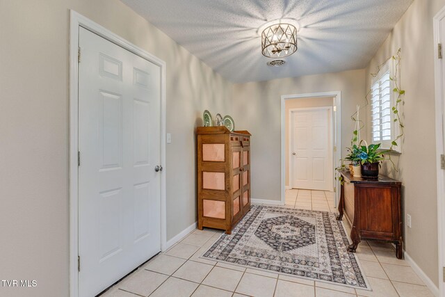 19275 Wyndale Rd, Abingdon, VA 24210 - entrance foyer featuring light tile patterned floors and a textured ceiling