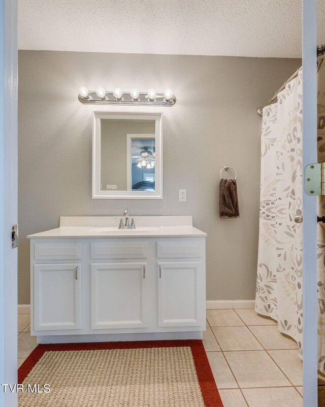19275 Wyndale Rd, Abingdon, VA 24210 - full bathroom with vanity, tile patterned flooring, and a shower with curtain