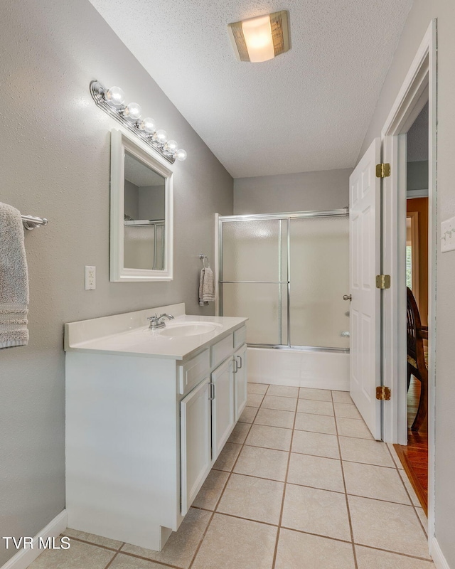 19275 Wyndale Rd, Abingdon, VA 24210 - full bath with vanity, a textured ceiling, enclosed tub / shower combo, and tile patterned floors