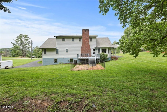 377 Overlook Dr, Blountville, TN 37617 - back of house with a chimney, a wooden deck, and a yard
