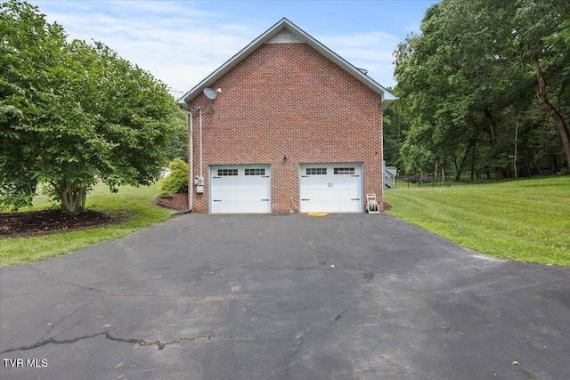 377 Overlook Dr, Blountville, TN 37617 - view of side of home with driveway, brick siding, a garage, and a yard