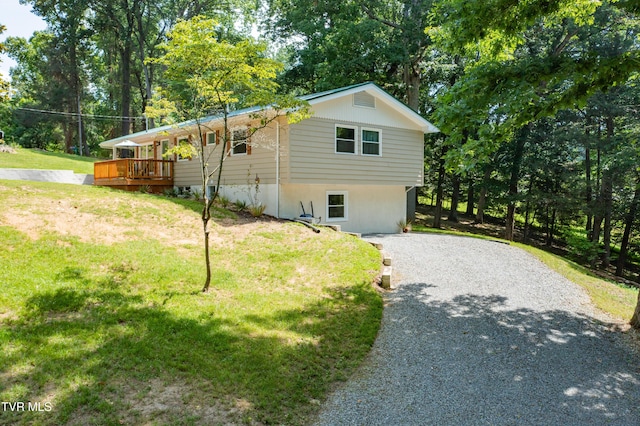 101 Ridgewood Dr, Bristol, TN 37620 - view of side of property featuring a yard, driveway, view of wooded area, and a deck