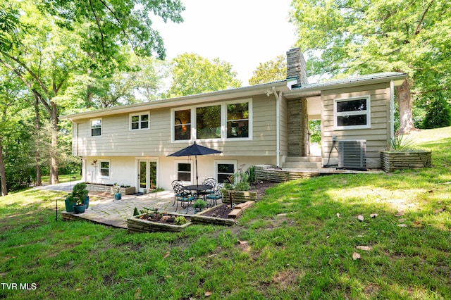 101 Ridgewood Dr, Bristol, TN 37620 - back of property with a chimney, a patio, and a lawn