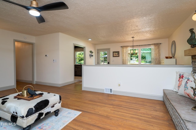 101 Ridgewood Dr, Bristol, TN 37620 - living area featuring a textured ceiling, light wood-style floors, and ceiling fan