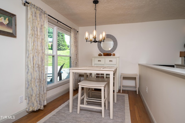 101 Ridgewood Dr, Bristol, TN 37620 - dining area with a chandelier, wood finished floors, and a textured ceiling