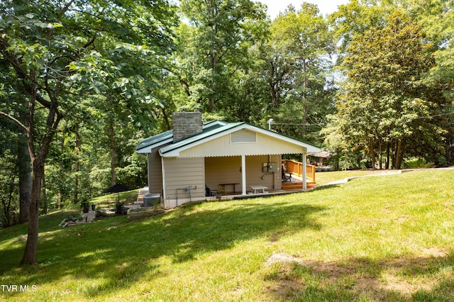 101 Ridgewood Dr, Bristol, TN 37620 - rear view of property featuring a chimney, a yard, and a porch