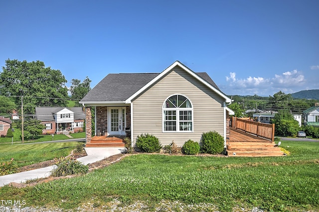 517 W Glade St, Glade Spring, VA 24340 - view of front of property featuring french doors, a front lawn, and a wooden deck