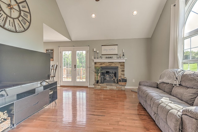 517 W Glade St, Glade Spring, VA 24340 - living area featuring french doors, high vaulted ceiling, a stone fireplace, recessed lighting, and wood finished floors