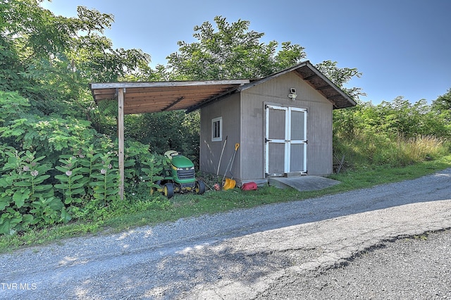 517 W Glade St, Glade Spring, VA 24340 - view of shed with a carport and driveway