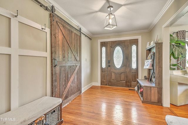 22643 Twin Oaks Rd, Abingdon, VA 24211 - entrance foyer with a barn door, light wood-type flooring, and crown molding