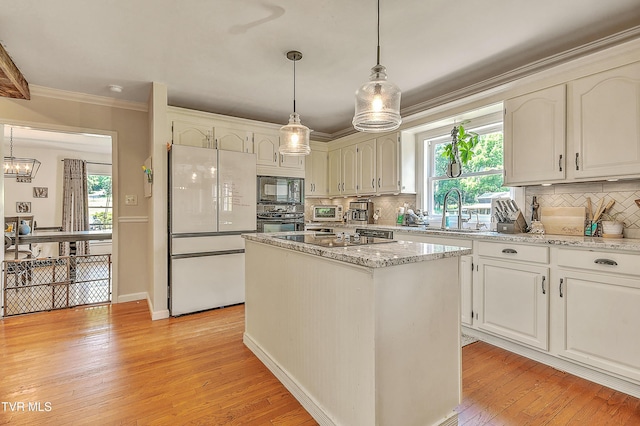22643 Twin Oaks Rd, Abingdon, VA 24211 - kitchen featuring black appliances, ornamental molding, plenty of natural light, tasteful backsplash, and light wood-style floors