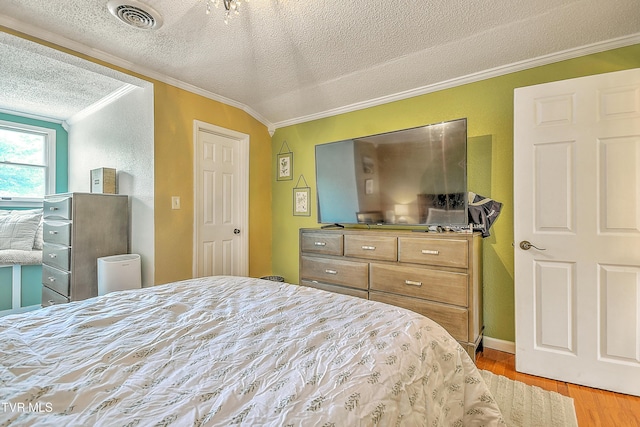 22643 Twin Oaks Rd, Abingdon, VA 24211 - bedroom featuring ornamental molding, a textured ceiling, and light wood-type flooring