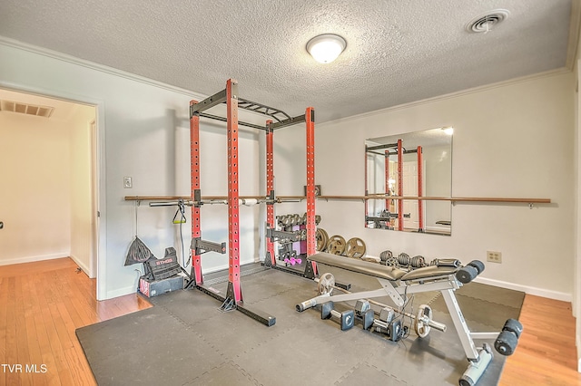 22643 Twin Oaks Rd, Abingdon, VA 24211 - exercise area with a textured ceiling, ornamental molding, and wood finished floors