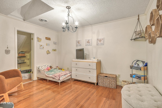 22643 Twin Oaks Rd, Abingdon, VA 24211 - bedroom featuring crown molding, a textured ceiling, light wood-type flooring, and a chandelier