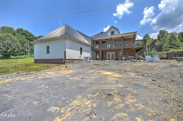 22643 Twin Oaks Rd, Abingdon, VA 24211 - back of house featuring a metal roof, stairs, french doors, a deck, and brick siding