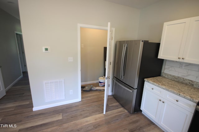 1524 Brown Ave, Jefferson City, TN 37760 - kitchen with white cabinets, decorative backsplash, and wood finished floors