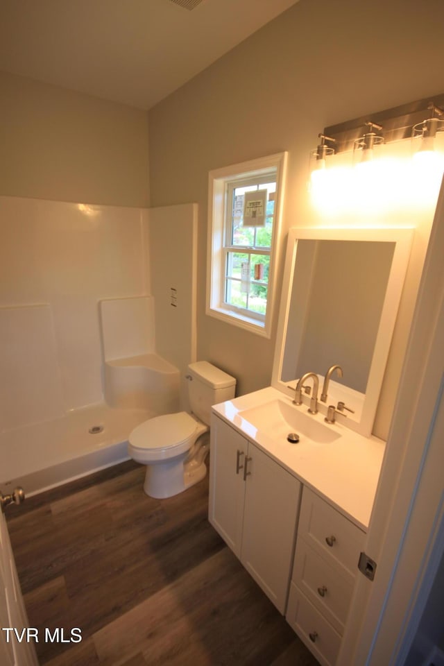 1524 Brown Ave, Jefferson City, TN 37760 - bathroom with vanity, wood finished floors, and a shower