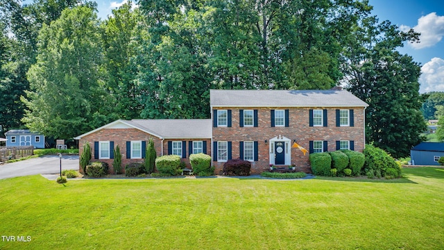 5116 Waterford Dr, Kingsport, TN 37664 - colonial-style house with a front lawn and brick siding