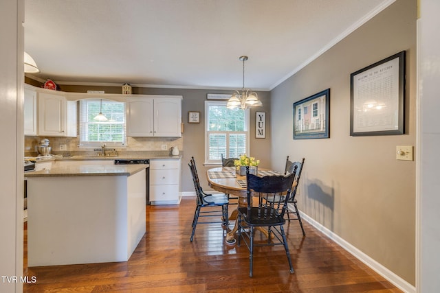 5116 Waterford Dr, Kingsport, TN 37664 - dining area featuring crown molding, dark wood-style floors, and a chandelier