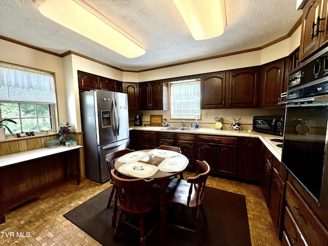 2572 May Rd, Talbott, TN 37877 - kitchen with black appliances, light countertops, dark brown cabinetry, a textured ceiling, and crown molding