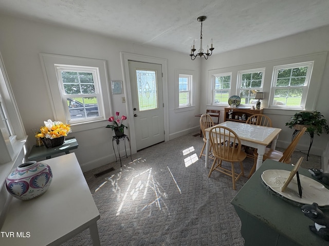 2572 May Rd, Talbott, TN 37877 - carpeted dining area with a chandelier and baseboards