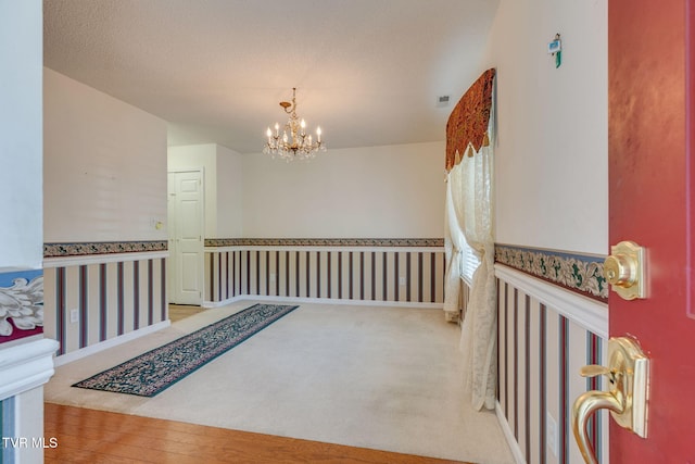 811 Fain Ave Unit 811, Kingsport, TN 37660 - hallway featuring a chandelier, carpet, and wood finished floors