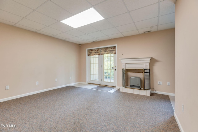 811 Fain Ave Unit 811, Kingsport, TN 37660 - unfurnished living room featuring carpet, a drop ceiling, and a tiled fireplace