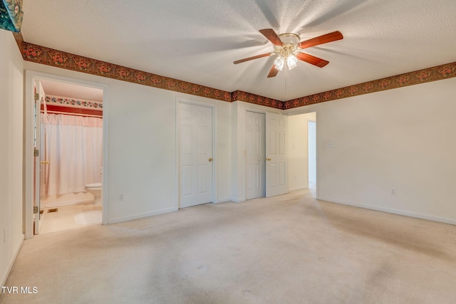 811 Fain Ave Unit 811, Kingsport, TN 37660 - unfurnished bedroom with light carpet, connected bathroom, a textured ceiling, and a ceiling fan