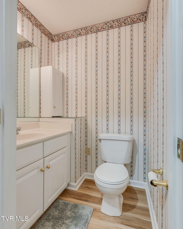 811 Fain Ave Unit 811, Kingsport, TN 37660 - half bath featuring vanity, wood finished floors, and wallpapered walls