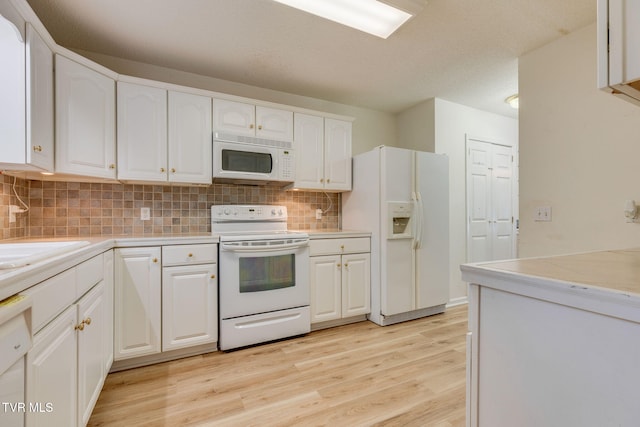 811 Fain Ave Unit 811, Kingsport, TN 37660 - kitchen with white appliances, white cabinets, light wood-type flooring, backsplash, and light countertops